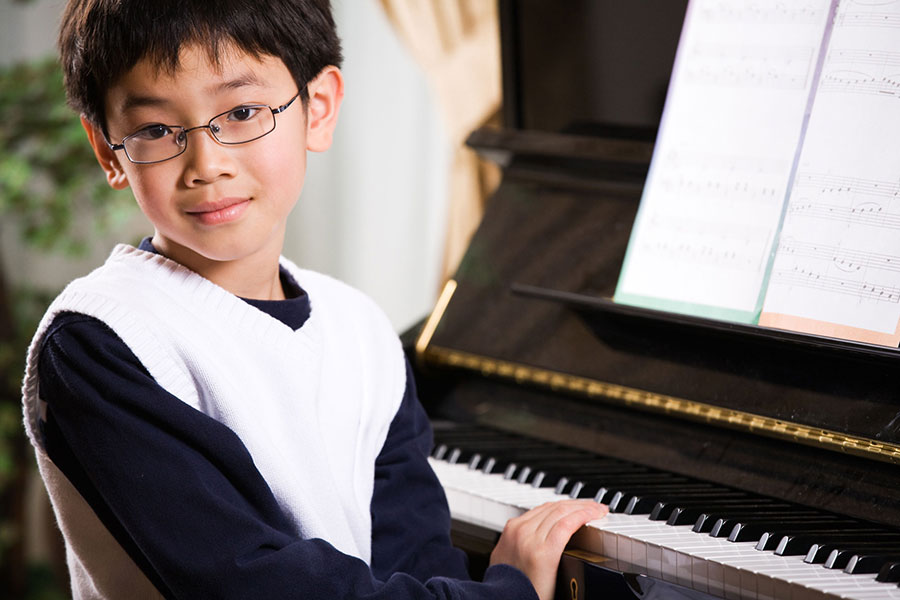 Young boy playing piano